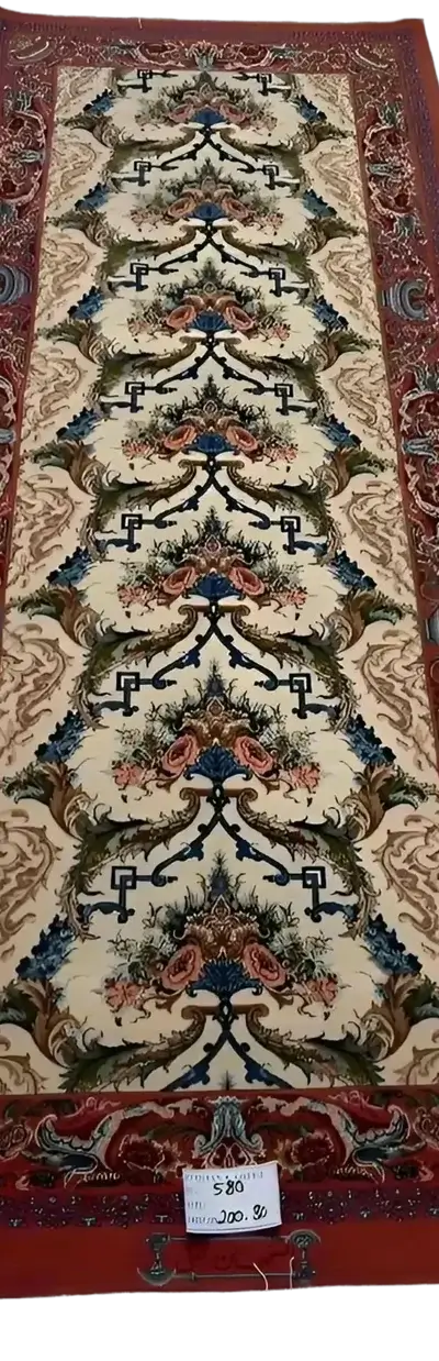 "Vintage-inspired Persian runner rug with red tones, knotted by hand using wool and silk. Dimensions: 200 cm x 80 cm, made in Isfahan, Iran."